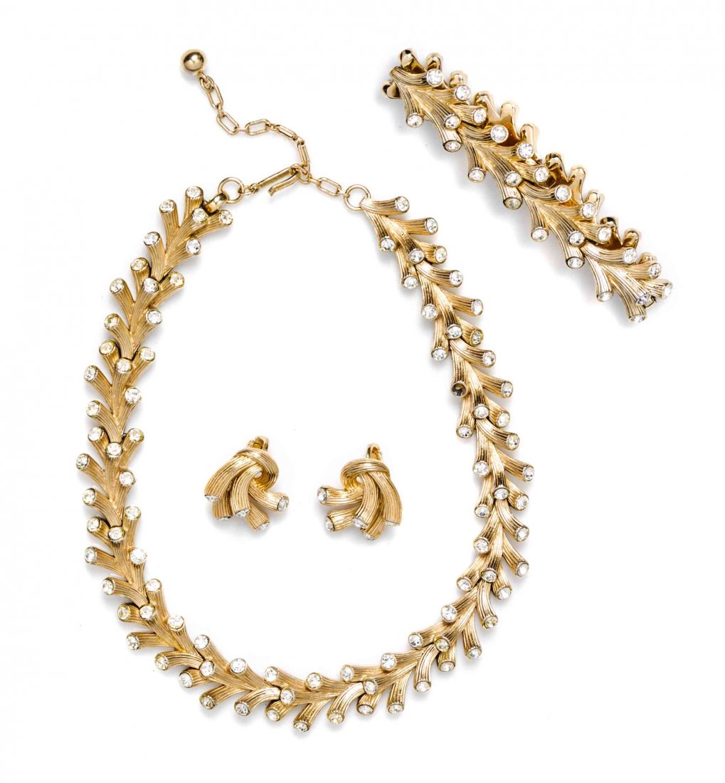 A Trifari Goldtone Rhinestone Demi Parure,: A Trifari Goldtone Rhinestone Demi Parure, comprised of a necklace, bracelet and a pair of earclips. Each stamped: Trifari. Property from the Collection of Dr. Perlita Campbell, Evanston, Illinois