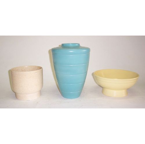 KEITH MURRAY FOR WEDGWOOD POTTERY Glazed ceramic;: KEITH MURRAY FOR WEDGWOOD POTTERY Glazed ceramic; three pieces, including a blue vase, a yellow bowl, and a speckled tan planter, chipped. Vase H: 11 1/2, bowl H: 4 1/2, Dia: 10; planter H: 6 1/4 in.