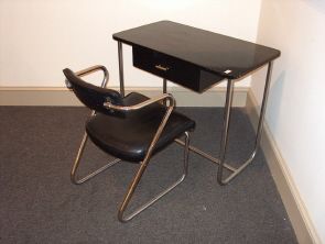 GILBERT ROHDE FOR TROY SUNSHADE DESK & CHAIR Chro: GILBERT ROHDE FOR TROY SUNSHADE DESK & CHAIR Chromium, laquered wood, leatherette; Troy-Sunshade cloth tag to chair. Desk H: 30, W: 36, D: 20 in., chair H: 30, W: 21, D: 22 1/2 in.