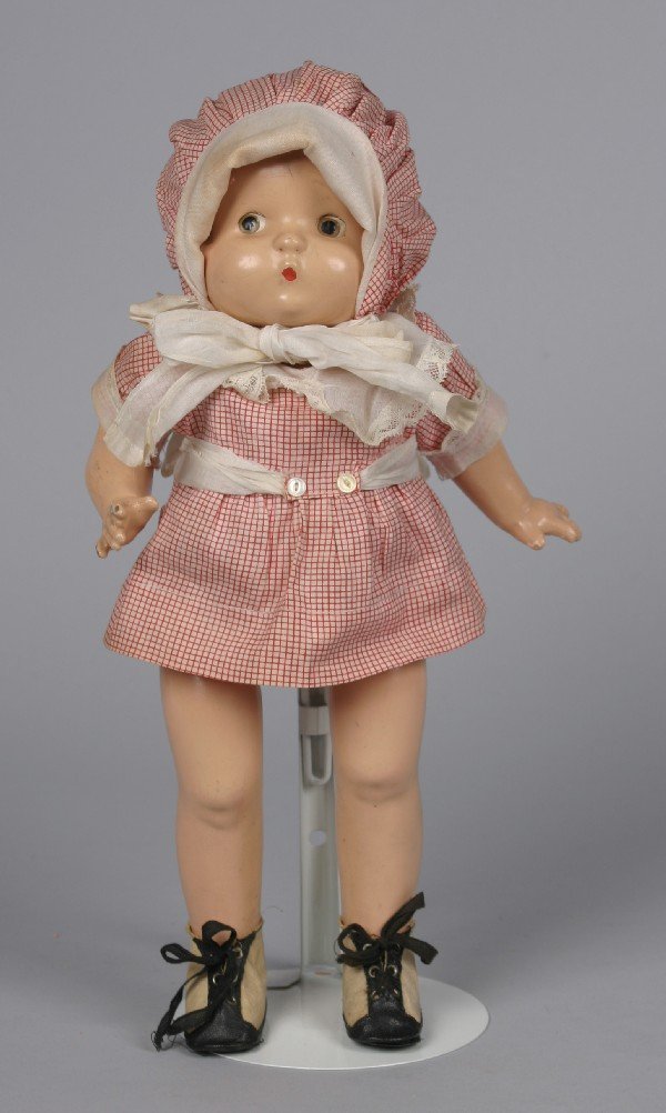 A Composition Effanbee Patsy, Height 14 inches.: A Composition Effanbee Patsy, 1928, comprising original outfit. Height 14 inches.