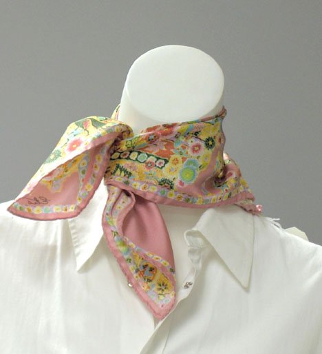 Two sacrves, one cotton Pucci and one silk Etro,: Two scarves, one cotton Pucci and one silk Etro The Pucci in an abstract design in pinks on a white ground; the Etro in pinks and bright florals, with tags.