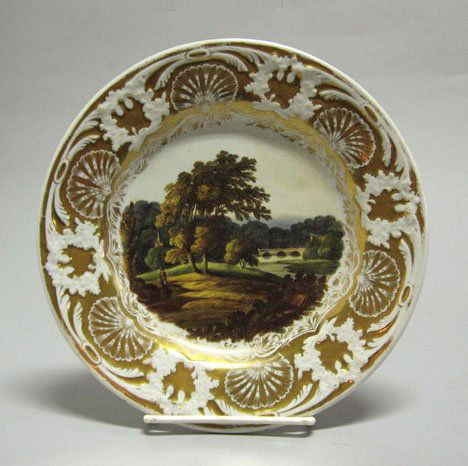 Mason's ironstone plate, circa 1820, possible pai: Mason's ironstone plate circa 1820, possible painted by samuel bourne Centrally painted with a rural scene, within a foliate relief shell decorated gilt enhanced border. Diam: 8 1/2 in.