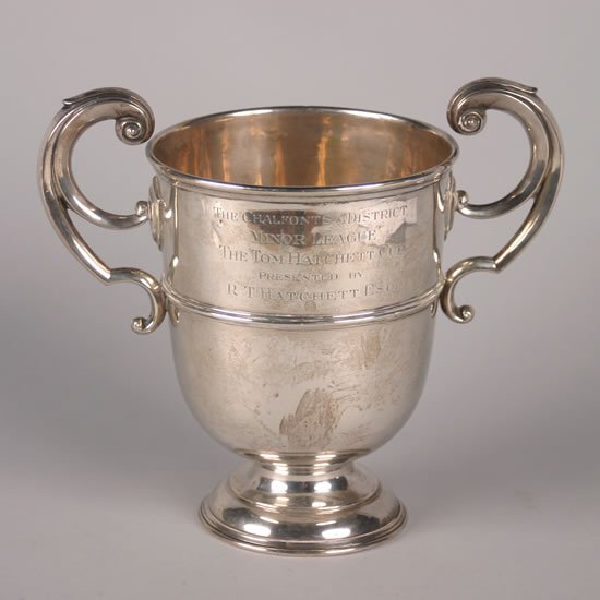 A Victorian Silver Loving Cup, Charles Boyton, Lon: A Victorian Silver Loving Cup, Charles Boyton, London, inscribed "The Chalfonts & District Minor League, The Tom Hatchett Cup Presented by R.T. Hatchett Esq." Height 9 3/4 inches.