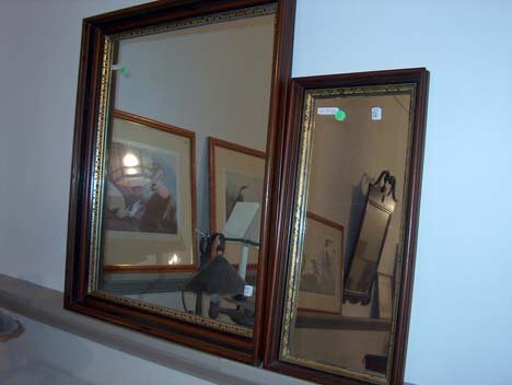 TWO VICTORIAN WALNUT WALL MIRRORS 19th c. With mo: TWO VICTORIAN WALNUT WALL MIRRORS 19th c. With molded shadowbox frames and ebonized and gilt accents. Hts: larger 32 x 26, smaller 23 1/4 x 11 in.