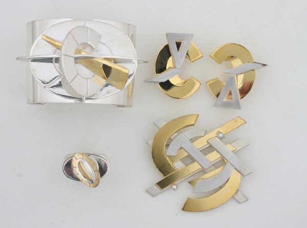 Group of John Okulick Jewelry: Group of John Okulick Jewelry A cuff, a pair of earrings, a brooch, and a ring; four pieces. Sold to benefit the Indianapolis Museum of Art.