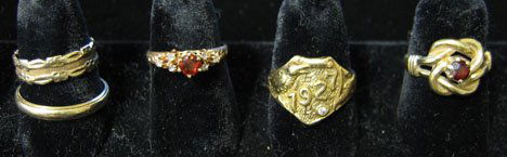 Five 14k Yellow Gold Rings, , With a 1927 class r: Five 14k Yellow Gold Rings With a 1927 class ring inset with a small diamond ( size 9 ), 2 with garnet stones ( 6 1/4 and 7 1/2 ) and 2 bands ( 7 1/2 and 10 ). 10.9 dwt.