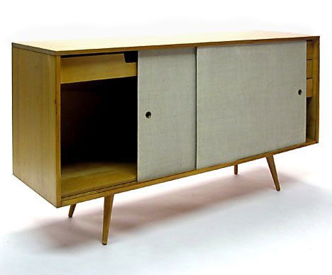 Paul McCobb Planner Group credenza, , Having twin: Paul McCobb Planner Group credenza Having twin light grey fabric covered sliding doors enclosing single drawer and shelf, the other side enclosing three drawers. H: 33 1/2 in., L: 60 in., D: 18 in.