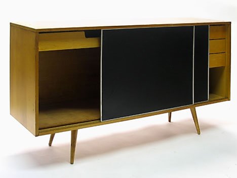 Paul McCobb Planner Group credenza, , Having twin: Paul McCobb Planner Group credenza Having twin black laminate sliding doors enclosing single drawer, the other side enclosing three drawers. H: 33 1/2 in., L: 60 in., D: 18 in.