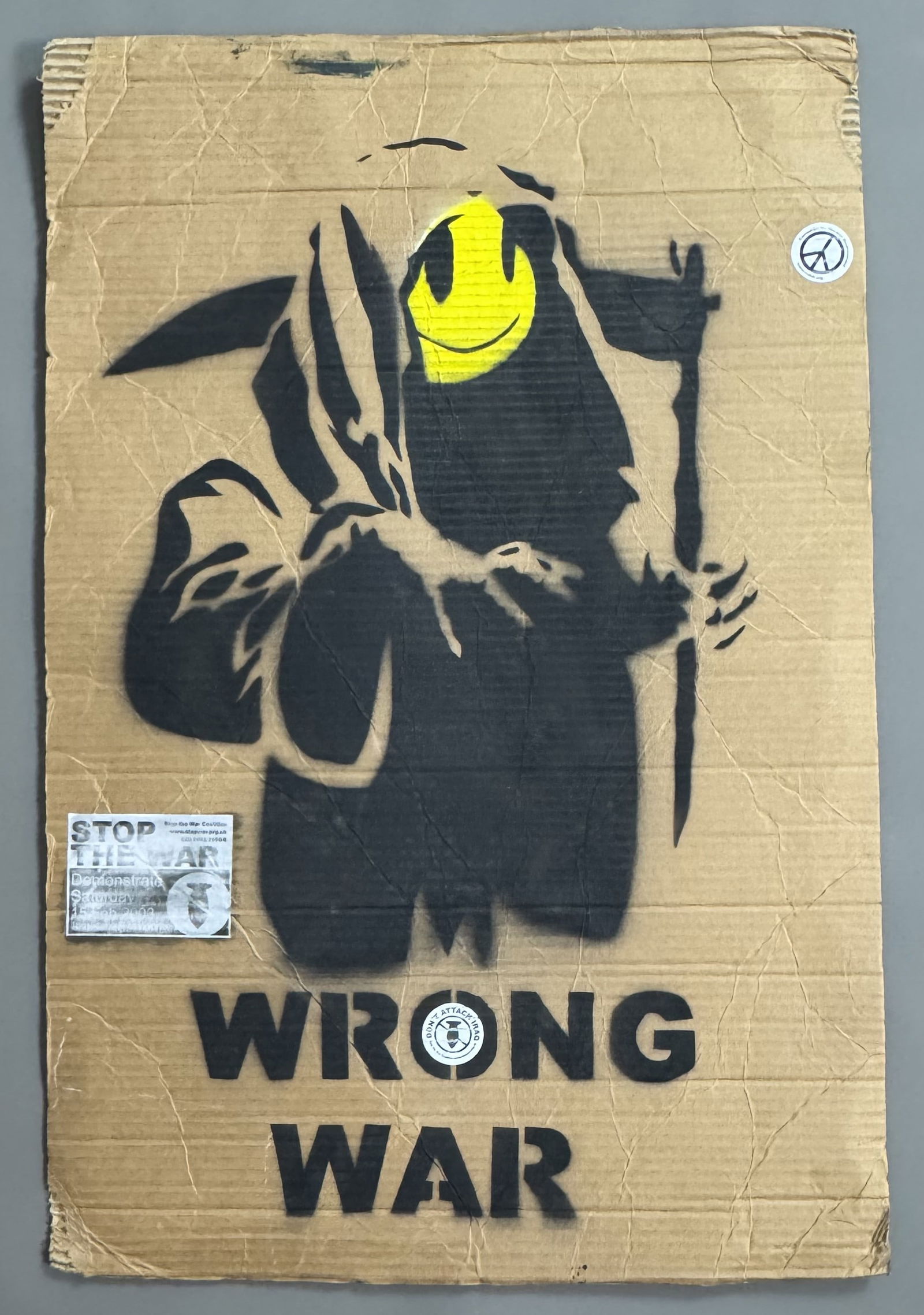 BANKSY (Né en 1974), ), d’après. Grim Reaper, Wrong War , 2003.: BANKSY (Né en 1974), ), d’après. Grim Reaper, Wrong War , 2003. Pochoir à l’aérosol sur carton de récupération. Stickers de la manifestation “Campaign f