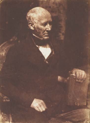 HILL, DAVID OCTAVIUS (1802-1870)/ADAMSON, ROBE: HILL, DAVID OCTAVIUS (1802-1870)/ADAMSON, ROBERT (1821-1848) Man posing with a book. Salted paper print from calotype negative, 6 1/4x4 3/4 inches (15.9x12.1 cm.), with notations, in pencil, and a Roy