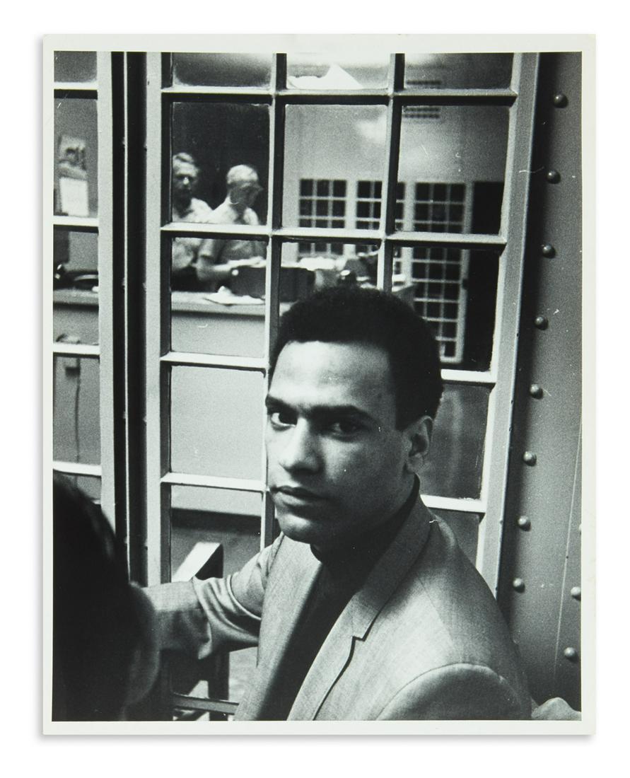 (BLACK PANTHERS.) Group of press photographs of Huey: (BLACK PANTHERS.) Group of press photographs of Huey Newton in prison and upon his release. 8 photographs, each 8 x 10 inches, with inked stamps of Globe Photos and other notations on verso; minor wea