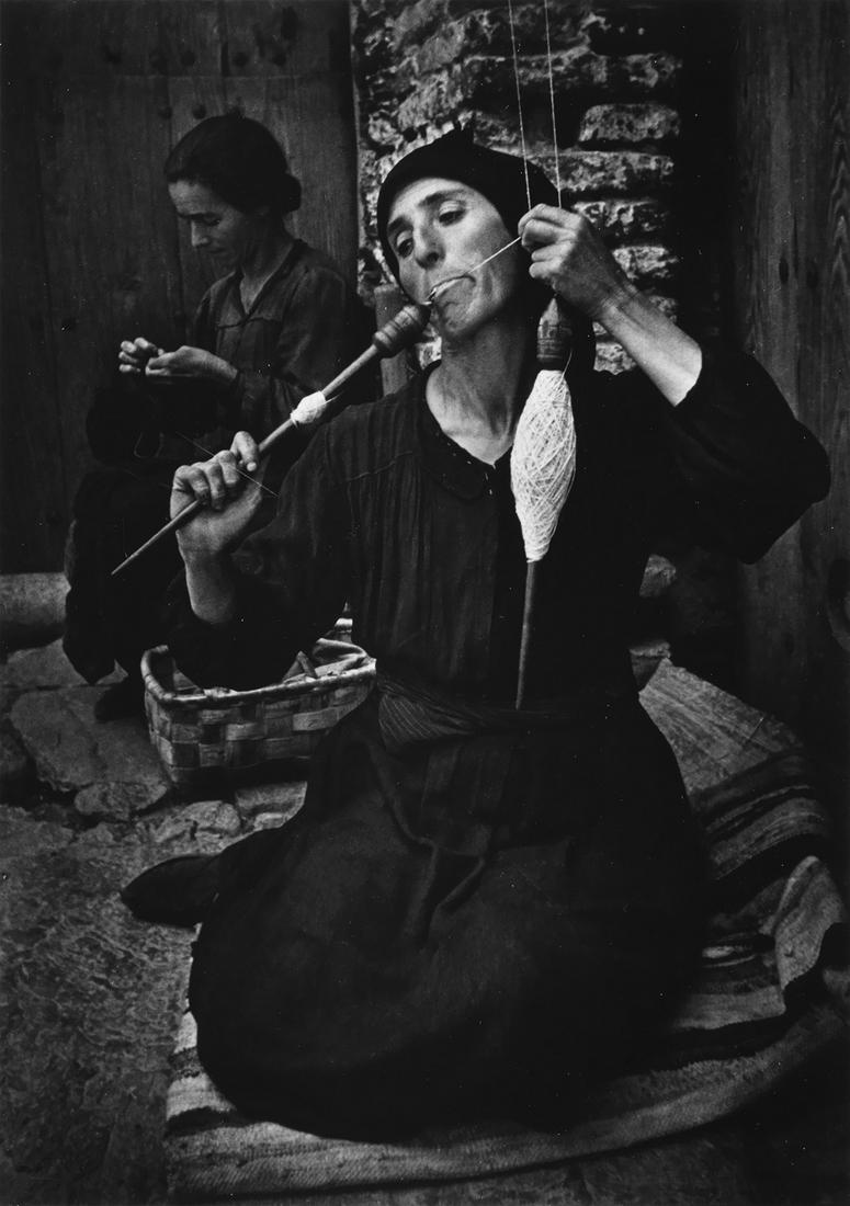 W. EUGENE SMITH (1918-1978) The Spinner.: W. EUGENE SMITH (1918-1978) The Spinner. Silver print, the image measuring 9½x6¾ inches (24.1x17.1 cm.), the mount 18x14 inches (45.7x35.6 cm.), with Smith's signature, with a stylus, on pri