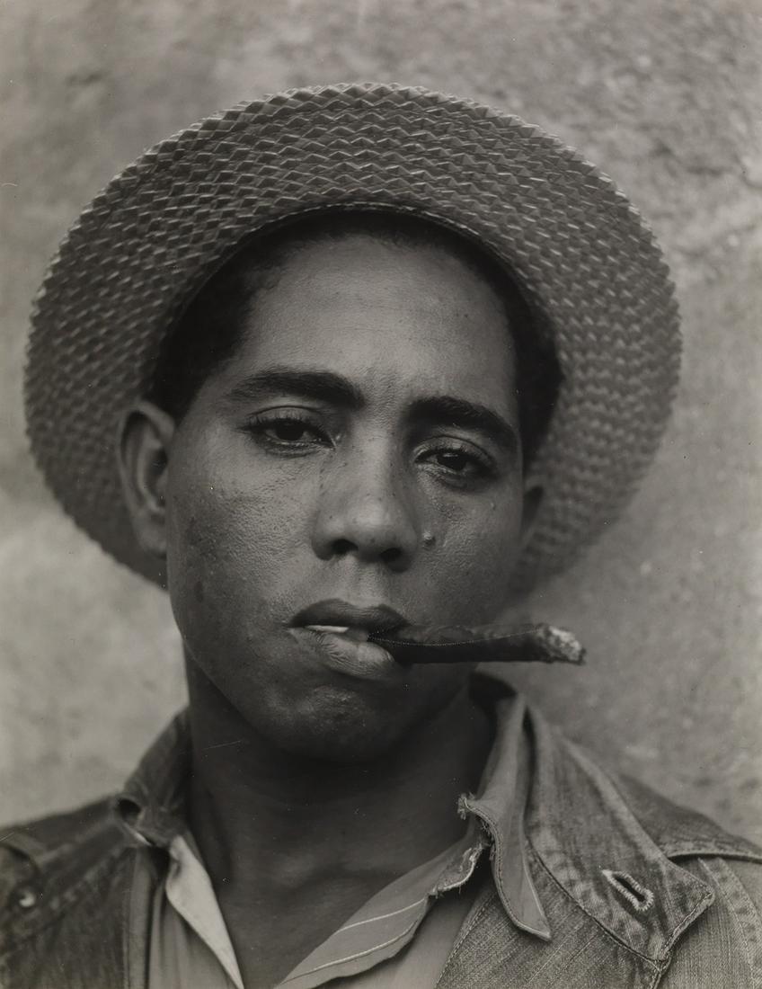 WALKER EVANS (1903-1975) Stevedore, Havana, Cuba (coal: WALKER EVANS (1903-1975) Stevedore, Havana, Cuba (coal dock worker). Silver print, the image measuring 7x6 inches (20x15.6 cm.), the mount 18x15 inches (45.7x38.1 cm.), with Evans' signature, in penci