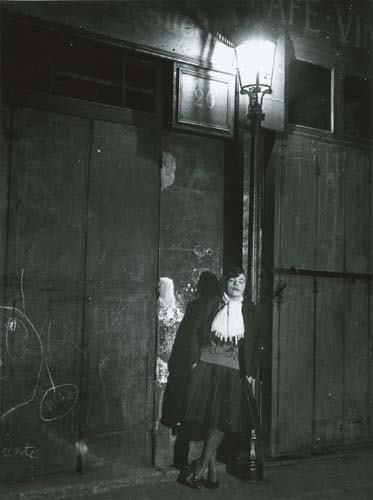 BRASSAÏ (1899-1984) "A Lady of the Evening, Ru: BRASSAÏ (1899-1984) "A Lady of the Evening, Rue de Lappe, Paris." Ferrotyped silver print, 11 1/4x8 1/2 inches (28.5x21.5 cm.), with Brassaï's signature, his handwritten notations "vintage," and his