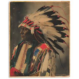 (AMERICAN INDIANS--PHOTOGRAPHS.) Frank A. Rinehart.: (AMERICAN INDIANS--PHOTOGRAPHS.) Frank A. Rinehart. Chief Hollow Horn Bear, Sioux. Hand-colored platinum print, 9¼ x 7½ inches, mounted on plain period board; moderate toning and wear