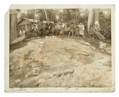 (AMERICAN INDIANS--PHOTOGRAPHS.) Photograph of an: (AMERICAN INDIANS--PHOTOGRAPHS.) Photograph of an Algonquian family with hunting camp operator George Ryman. Photograph, 10 x 8 inches, with manuscript caption "George H. Ryman with his Indian family