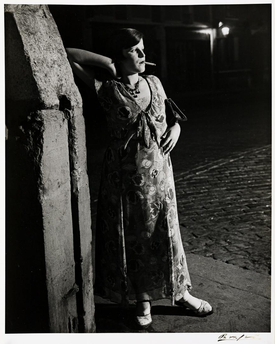 BRASSAÏ (1899-1984) Jeune Fille de Joie, en Robe: BRASSAÏ (1899-1984) Jeune Fille de Joie, en Robe Printanière, Paris. Silver print, the image measuring 11x8 inches (28x22.5 cm.), the sheet 12x9¼ inches (30.5x23.5 cm.), with Brassa