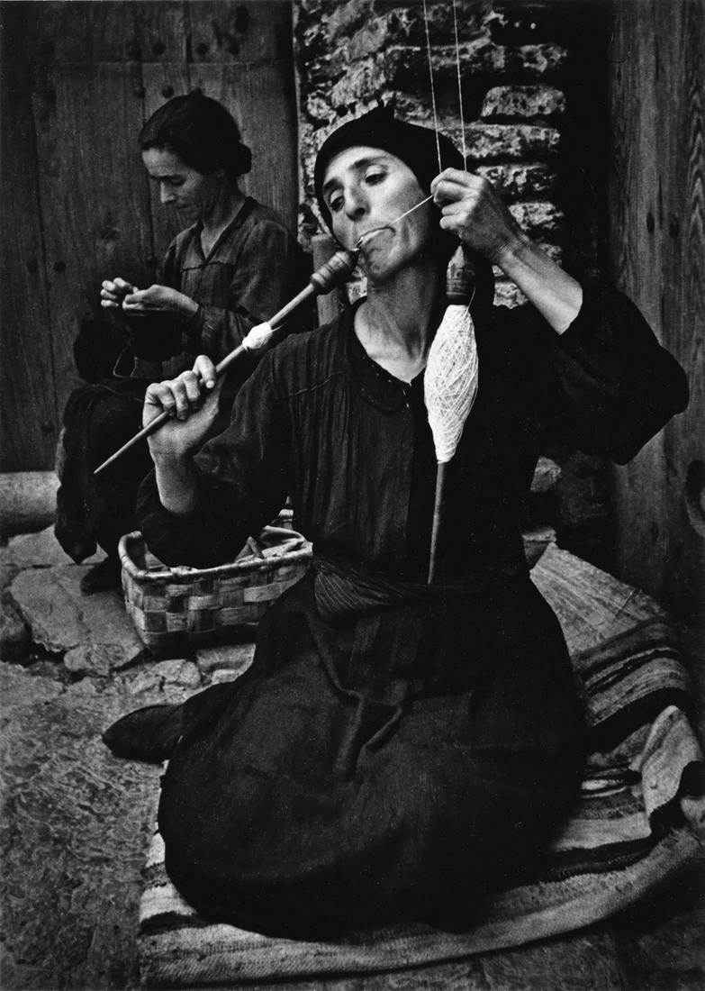 W. EUGENE SMITH (1918-1978) Spinner, from Spanish: W. EUGENE SMITH (1918-1978) Spinner, from Spanish Village. Silver print, the image measuring 9½x6¾ inches (24.1x17.1 cm.), the mount 20x16 inches (50.8x40.6 cm.), with Smith's signature, wit