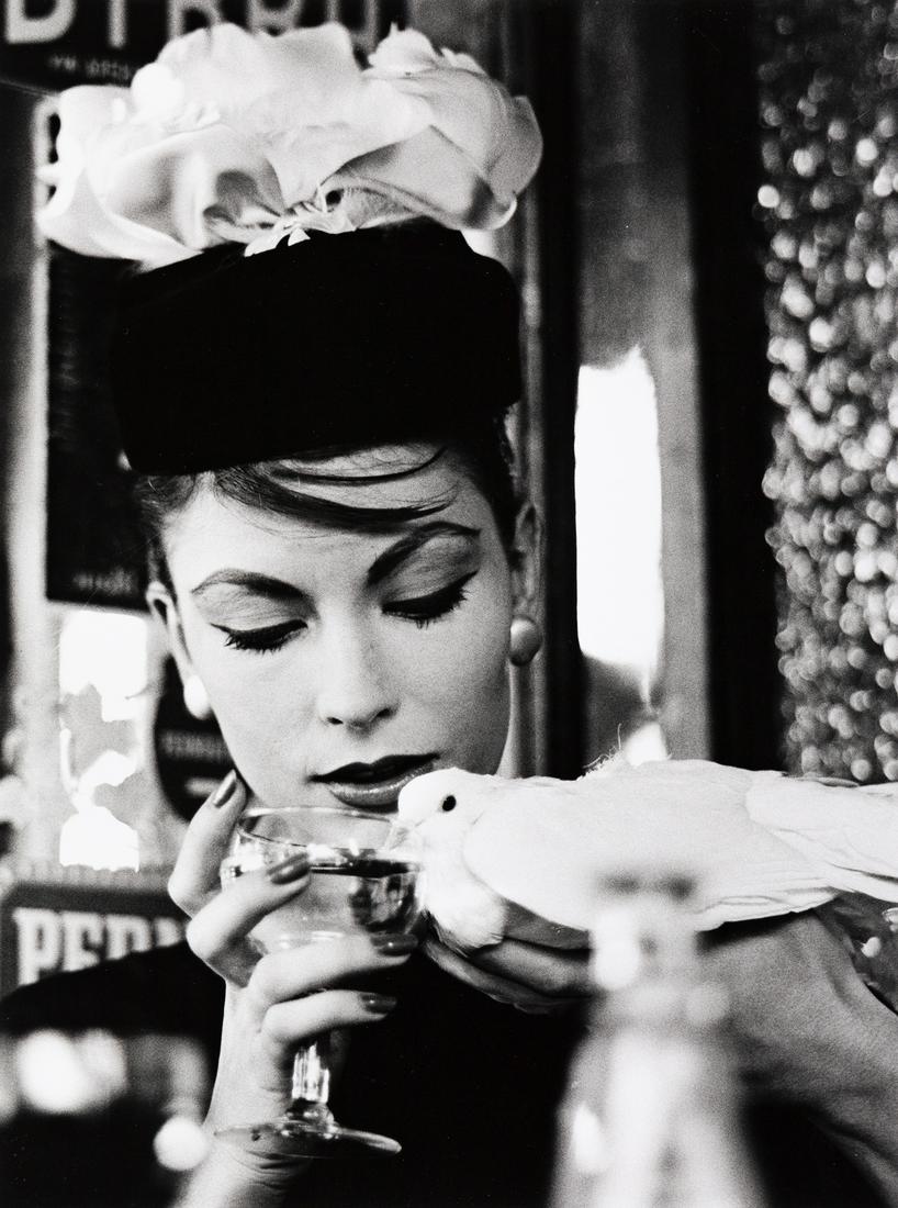 WILLIAM KLEIN (1928- ) Mary + Dove + Cafe, Paris.: WILLIAM KLEIN (1928- ) Mary + Dove + Cafe, Paris. Silver print, the image measuring 17¼x12¾ inches (43.8x32.4 cm.), the sheet 19x16 inches (50.5x40.6 cm.), with Klein's signature, title, and
