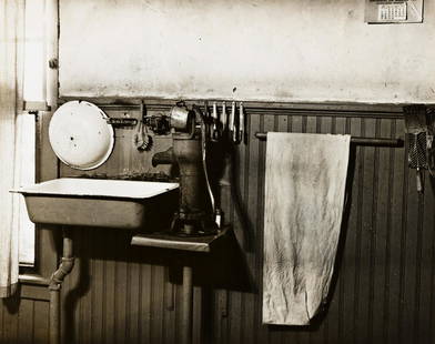 PETER SEKAER (1901-1950) Old Fashioned Kitchen on: PETER SEKAER (1901-1950) Old Fashioned Kitchen on Virginia Farm. Silver print, the image measuring 184.2x235 mm; 7¼x9¼ inches, flush mounted, with the title, in pencil, and Sekaer's credit