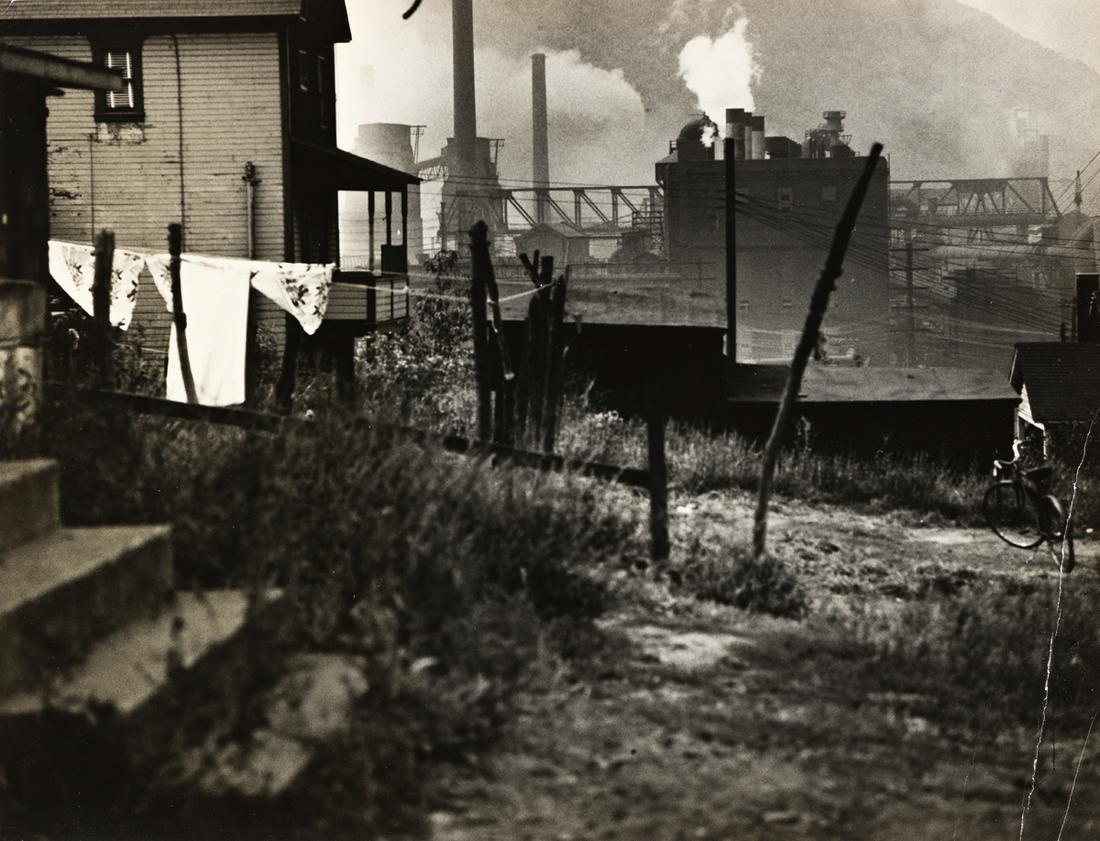 WALKER EVANS (1903-1975) Houses near a steel mill: WALKER EVANS (1903-1975) Houses near a steel mill (Bethlehem, PA). Silver print, the image measuring 203.2x263.5 mm; 8x10 inches, with Evans' signature, in pencil, and his 124 East 84th St., New York