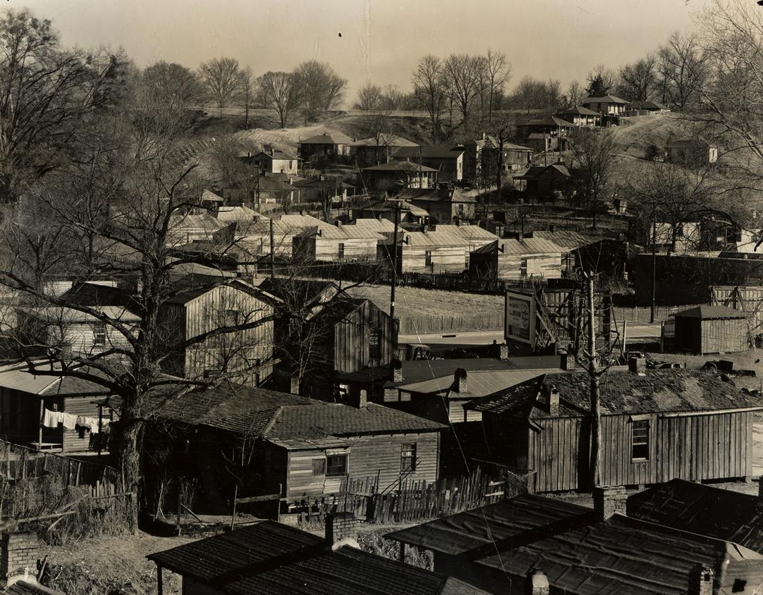 WALKER EVANS (1903-1975) Houses in the Negro Quarter,: WALKER EVANS (1903-1975) Houses in the Negro Quarter, Vicksburg, Mississippi. Silver print, the image measuring 193.7x241.3 mm; 7x9½ inches, the sheet slightly larger, with Evans' signature, in p