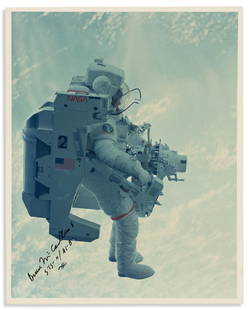 (ASTRONAUTS.) MCCANDLESS II, BRUCE. Photograph Signed: (ASTRONAUTS.) MCCANDLESS II, BRUCE. Photograph Signed with holograph mission number ("STS-11 / 41-B"), full-length portrait showing him in profile in the Manned Maneuvering Unit fitted with the