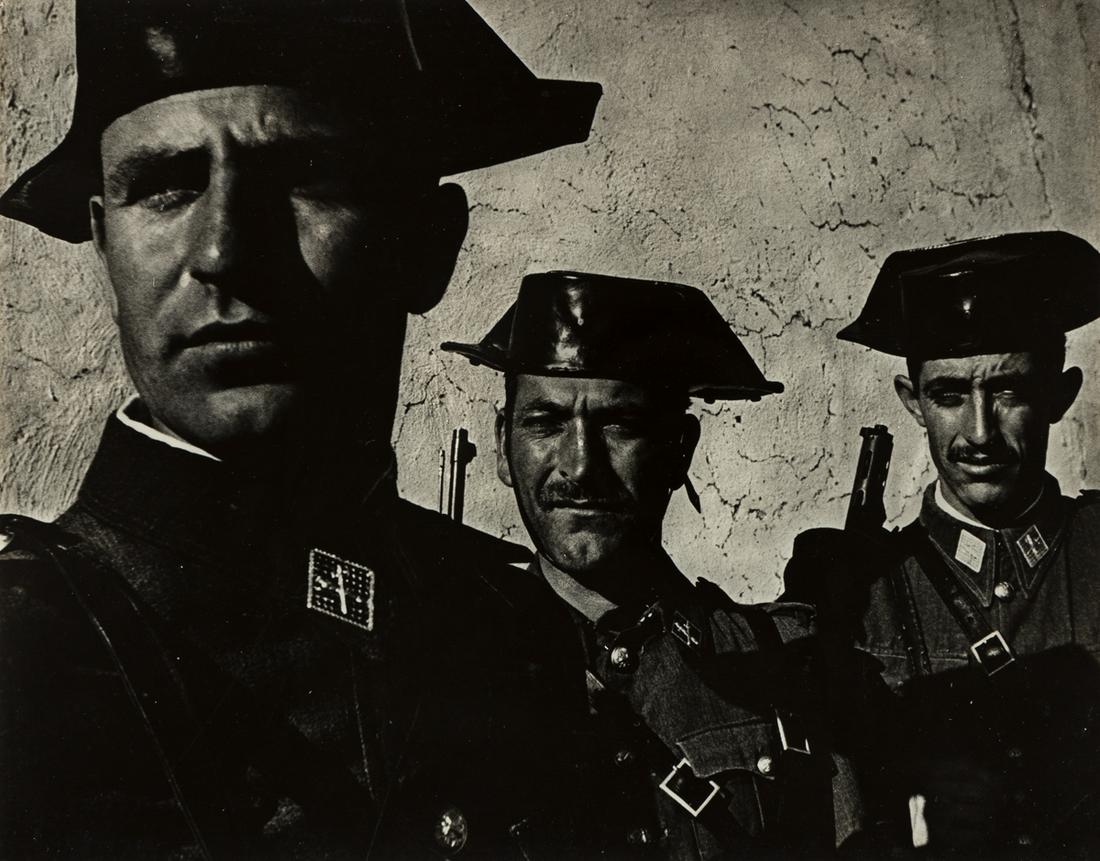 W. EUGENE SMITH (1918-1978) Guardia Civil, Spain.: W. EUGENE SMITH (1918-1978) Guardia Civil, Spain. Silver print, the image measuring 7x9 inches (18.1x23.2 cm.), with Smith's notation "to mount," in pencil, on verso. 1950