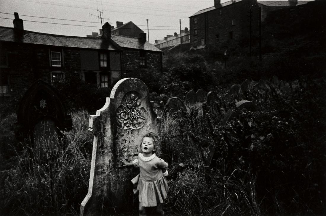 BRUCE DAVIDSON (1933- ) Little girl in cemetery.: BRUCE DAVIDSON (1933- ) Little girl in cemetery. Silver print, the image measuring 8x12 inches (20.3x30.5 cm.), the sheet 11x14 inches (27.9x35.6 cm.), with Davidson's signature, in pencil, on verso.