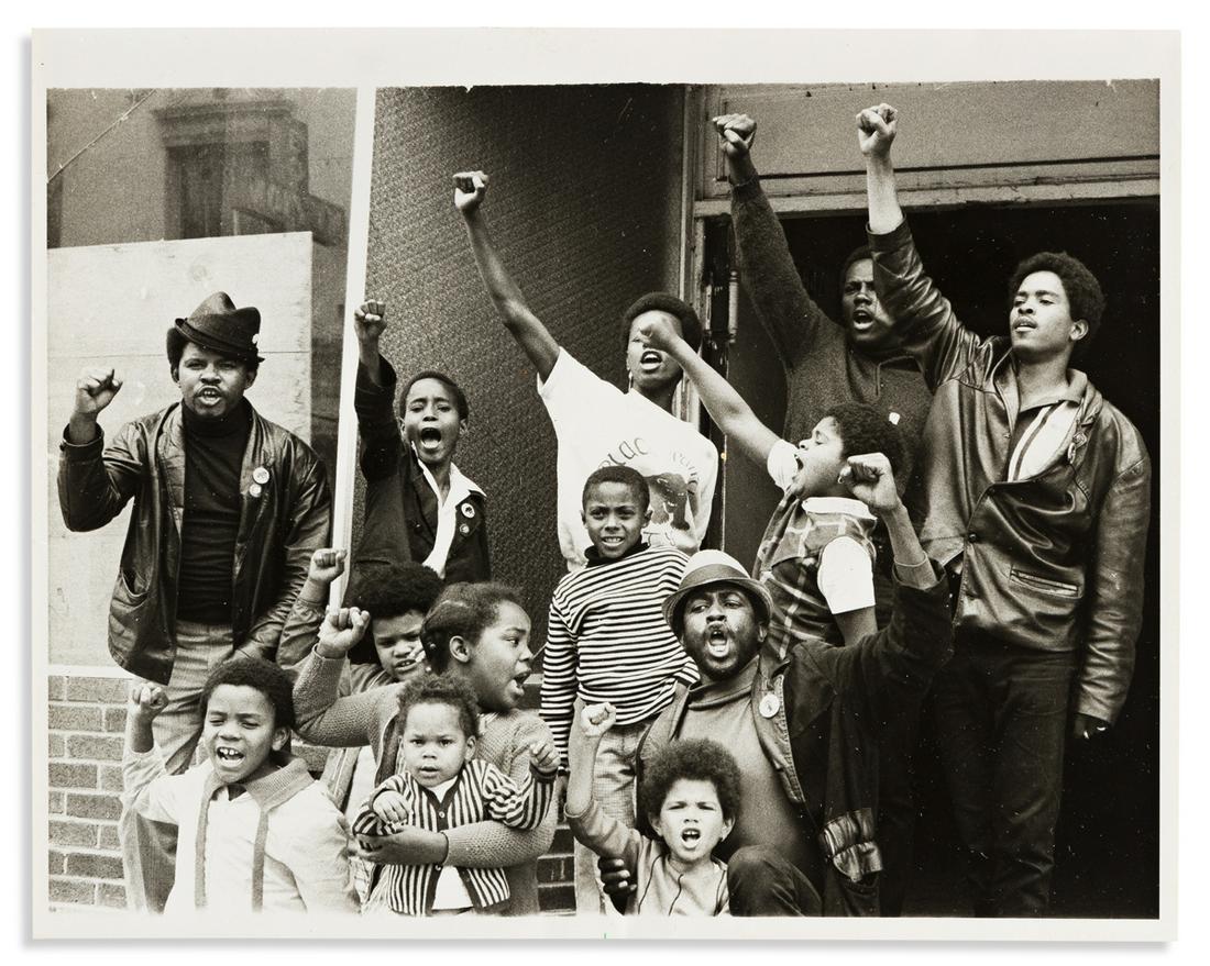 (BLACK PANTHERS.) Group of 9 press photographs of the: (BLACK PANTHERS.) Group of 9 press photographs of the Black Panthers. Each 8 x 10 inches, with inked UPI stamps on verso, captioned either in image or by slips affixed to verso; minimal wear. Vp, 1968