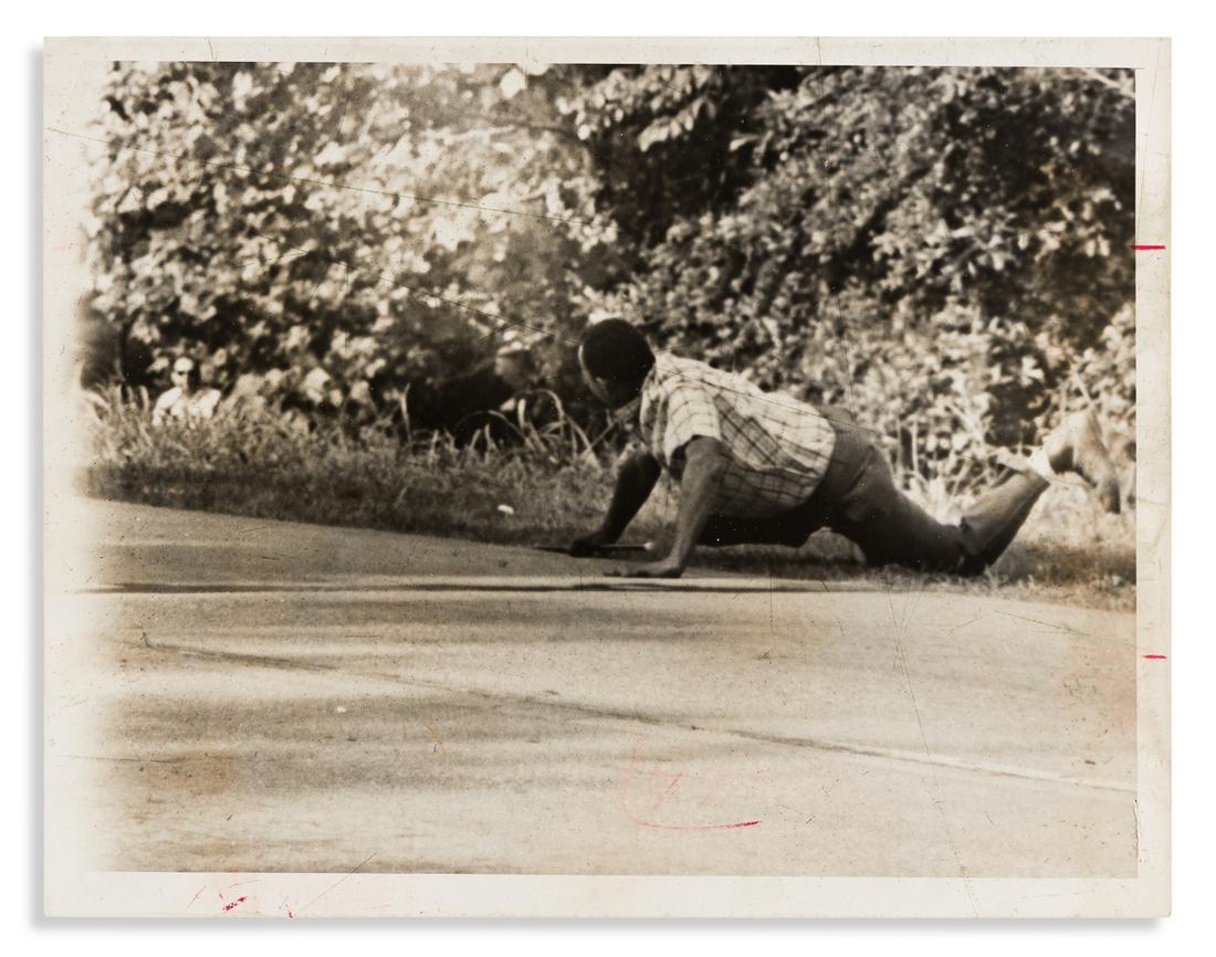 (CIVIL RIGHTS.) Pair of press photographs of the: (CIVIL RIGHTS.) Pair of press photographs of the shooting of James Meredith on the March Against Fear. Wire photographs, 7 x 9 inches; light crop marks in margins, Chronicle Magazine stamps and markin