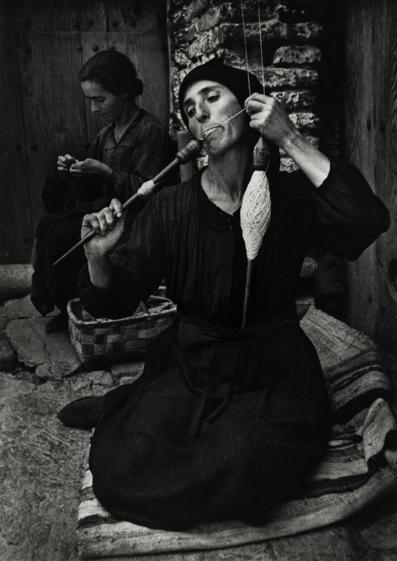 W. EUGENE SMITH (1918-1978) Spinner, from Spanish: W. EUGENE SMITH (1918-1978) Spinner, from Spanish Village. Silver print, the image measuring 12¾x9 inches (32.4x22.9 cm.) , the mount 19¾x16 inches (50.2x40.6 cm.) , with Smith's signature,