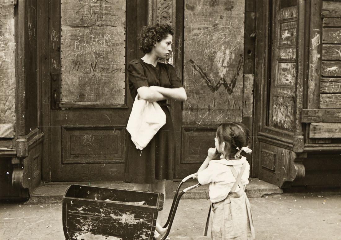 HELEN LEVITT (1913-2009) N.Y. (woman and child with: HELEN LEVITT (1913-2009) N.Y. (woman and child with carriage) . Silver print, the image measuring 2¼x3¼ inches (5.7x8.3 cm.) , the sheet slightly larger, with Levitt's initials and the numer