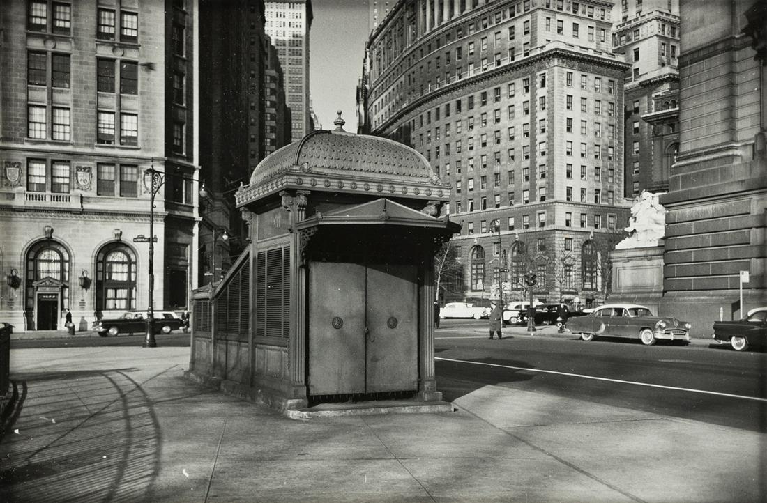 WALKER EVANS (1903-1975) Bowling Green Subway: WALKER EVANS (1903-1975) Bowling Green Subway Entrance. Silver print, the image measuring 6x9 inches (16.8x25.1 cm.) , the sheet 11x14 inches (27.9x35.6 cm.) , with a caption, in blue pencil, on recto