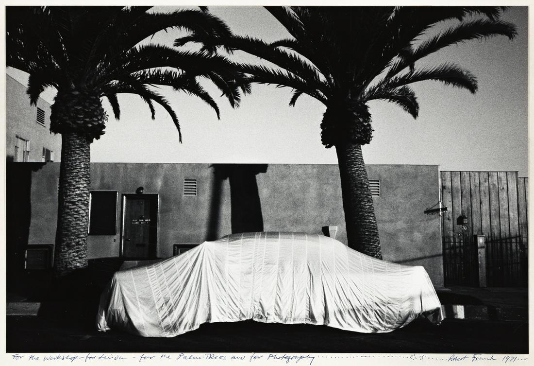 ROBERT FRANK (1924-2019) Covered Car, Long Beach,: ROBERT FRANK (1924-2019) Covered Car, Long Beach, California. Silver print, the image measuring 8¾x13¼ inches (22.2x33.7 cm.) , the mount 18x22 inches (45.7x55.8 cm.) , with Frank's signatur