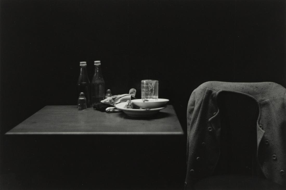 ROY DECARAVA (1919-1919) Catsup Bottles, Table and: ROY DECARAVA (1919-1919) Catsup Bottles, Table and Coat, New York. Silver print, the image measuring 8¾x13 inches (22.2x33 cm.) , the sheet 11x14 inches (27.9x35.6 cm.) , with DeCarava's signatur