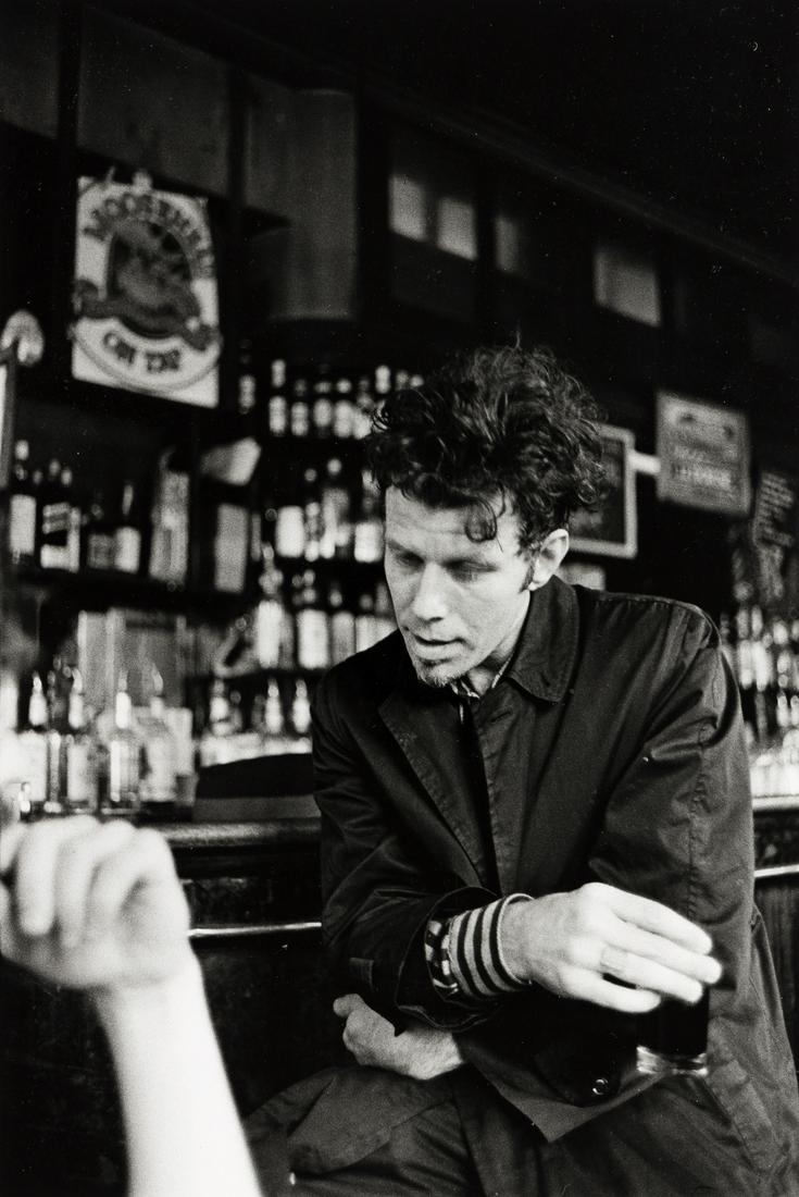 ROBERT FRANK (1951-2019) Portrait of Tom Waits.: ROBERT FRANK (1951-2019) Portrait of Tom Waits. Silver print, the image measuring 13x8¾ inches (33x22.2 cm.) , the sheet 14x11 inches (27.9x35.6 cm.) , with Frank's signature and negative date, i