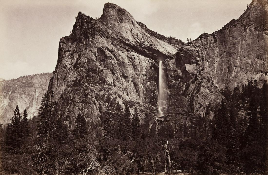 CARLETON E. WATKINS (1829-1916) The Bridal Veil and: CARLETON E. WATKINS (1829-1916)The Bridal Veil and Cathedral Rocks from the Coulterville Trail. Albumen print, the image measuring 7x11 inches (19.4x29.5 cm.), the two-toned mount 15¾x19½