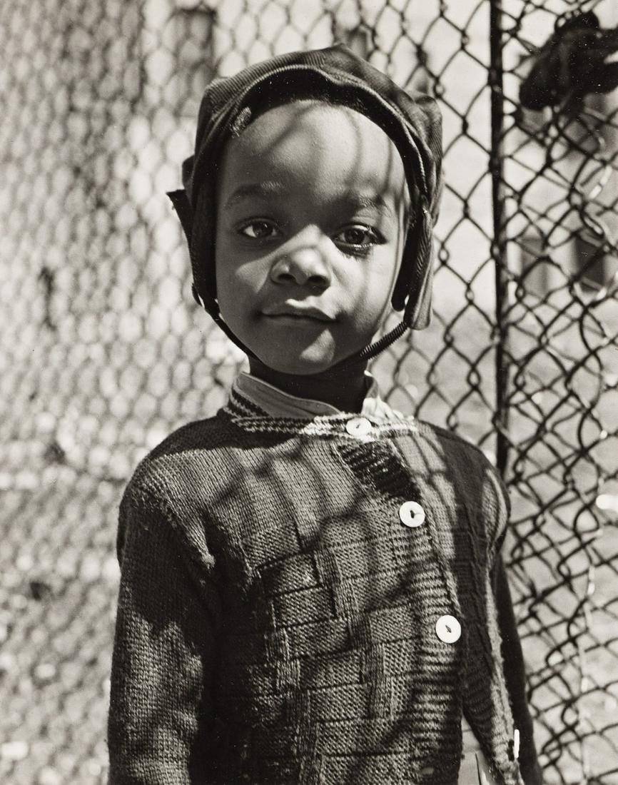 WALTER ROSENBLUM (1919-2006) Smiling child, 105th: WALTER ROSENBLUM (1919-2006)Smiling child, 105th Street, New York. Silver print, the image measuring 9¼x7 inches (23.5x18.7 cm.), the sheet slightly larger, flush mounted, with Rosenblum's sign