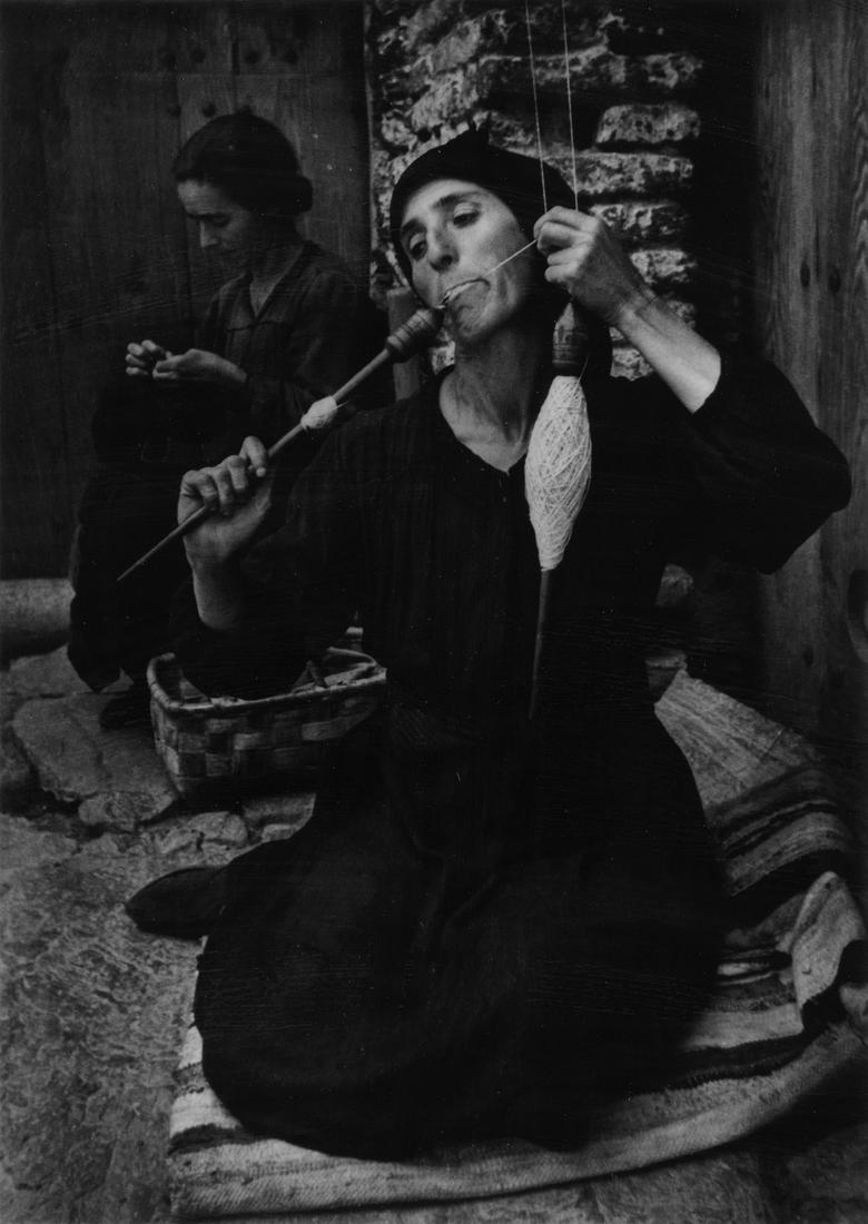 W. EUGENE SMITH (1918-1978) Spanish Spinner.: W. EUGENE SMITH (1918-1978)Spanish Spinner. Silver print, the image measuring 12¾x9 inches (32.4x23.2 cm.), the mount 19x15 inches (48.3x38.1 cm.), with Smith's signature, with a stylus, on pri