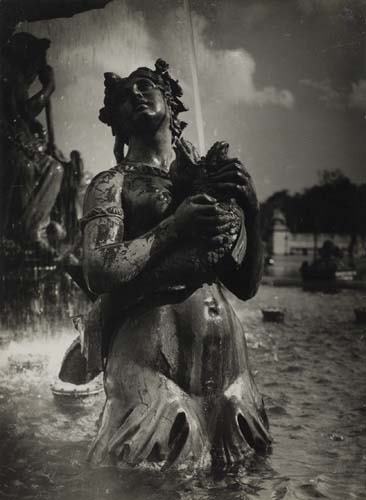 BRASSAÏ (1899-1984) "Fountains in the Place de: BRASSAÏ (1899-1984) "Fountains in the Place de la Concorde, Paris." Silver print, 9 1/2x7 inches (24x17.8 cm.), with Brassaï's "Gyula Halasz, 75, Rue de Guerchere" hand stamp on verso. 1933 A beauti