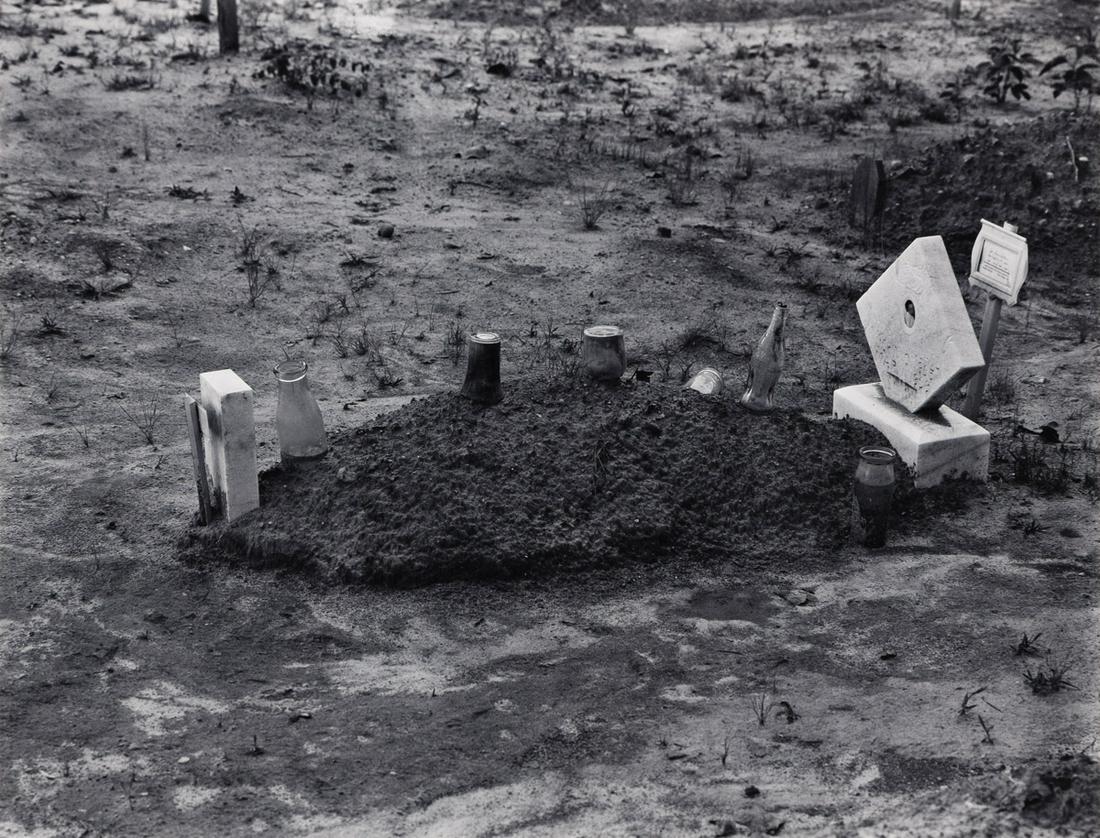 WALKER EVANS (1903-1975) Child's Grave with Bottles and: WITH A SIGNED MESSAGE FROM THE INTERIOR WALKER EVANS (1903-1975) Child's Grave with Bottles and Jars on Plot, Hale County, Alabama. Silver print, the image measuring 181x235 mm; 7x9¼ inches, the