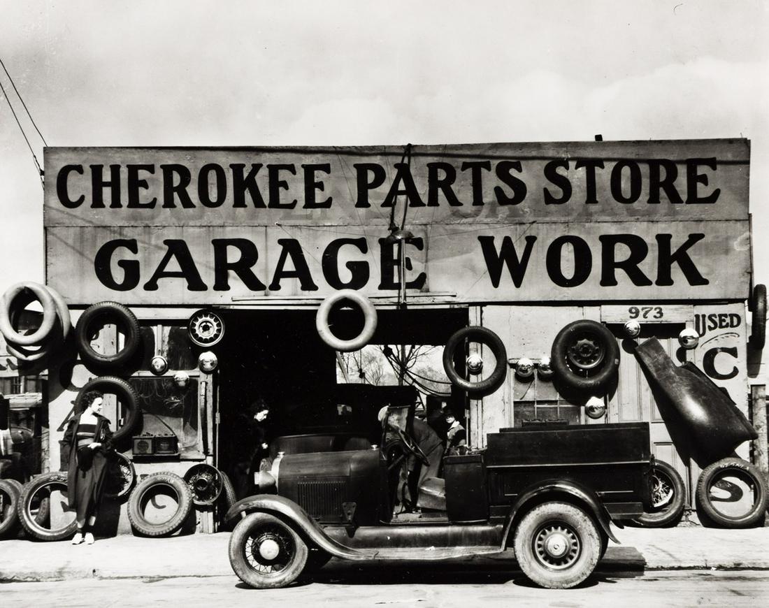 WALKER EVANS (1903-1975) Cherokee Parts Store Garage: WALKER EVANS (1903-1975) Cherokee Parts Store Garage Work, Atlanta, Georgia * Street scene, Vicksburg, Mississippi. Together, 2 photographs. Silver prints, the images measuring 190.5x241.3 mm; 7½
