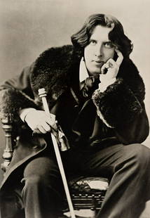 NAPOLEON SARONY (1821-1896) Oscar Wilde with a cane.: NAPOLEON SARONY (1821-1896) Oscar Wilde with a cane. Silver print, the image measuring 9¼x6½ inches (23.5x16.5 cm.), the sheet 10x8 inches (25.4x20.3 cm.) with the subject's name, in pencil,