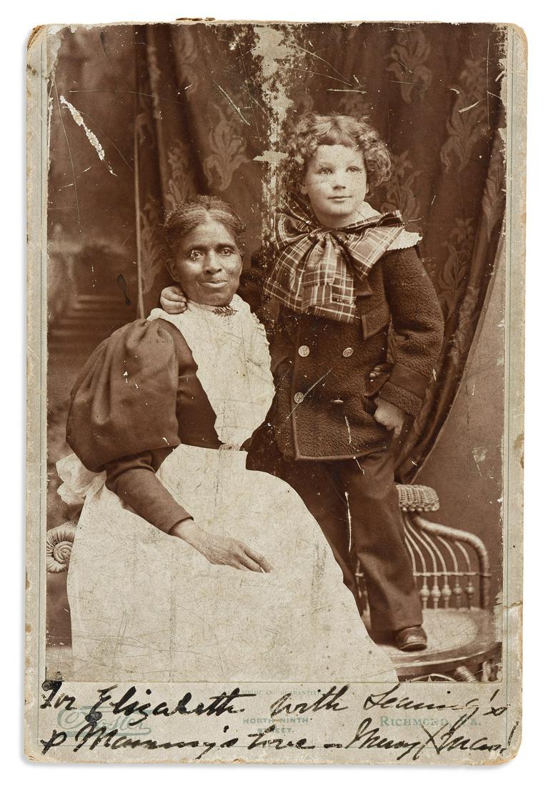 (PHOTOGRAPHY.) Cabinet card of a Virginia servant and her young charge.: (PHOTOGRAPHY.) Cabinet card of a Virginia servant and her young charge. Photograph, 5½ x 3¾ inches, on photographer's mount, signed in lower margin "For Elizabeth, with Searing's & Mammy's l