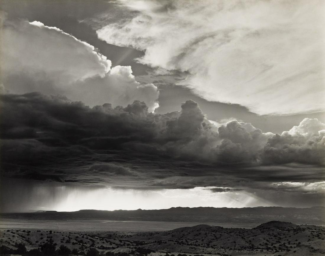 LAURA GILPIN (1891-1979) Storm over La Bajada Hill.: LAURA GILPIN (1891-1979) Storm over La Bajada Hill. Silver print, the image measuring 15½x19½ inches (39.3x49.5 cm.), the sheet slightly larger, the mount 22x26 inches (55.9x66 cm.), wit