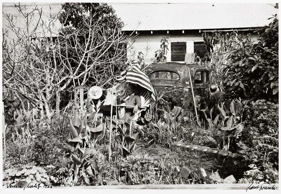 ROBERT FRANK (1924-2019) Backyard--Venice West, California.: ROBERT FRANK (1924-2019) Backyard--Venice West, California. Silver print, the image measuring 8x12 inches (20.3x30.5 cm), the sheet 11x14 inches (27.9x35.6 cm), with Frank's signature, title, and nega