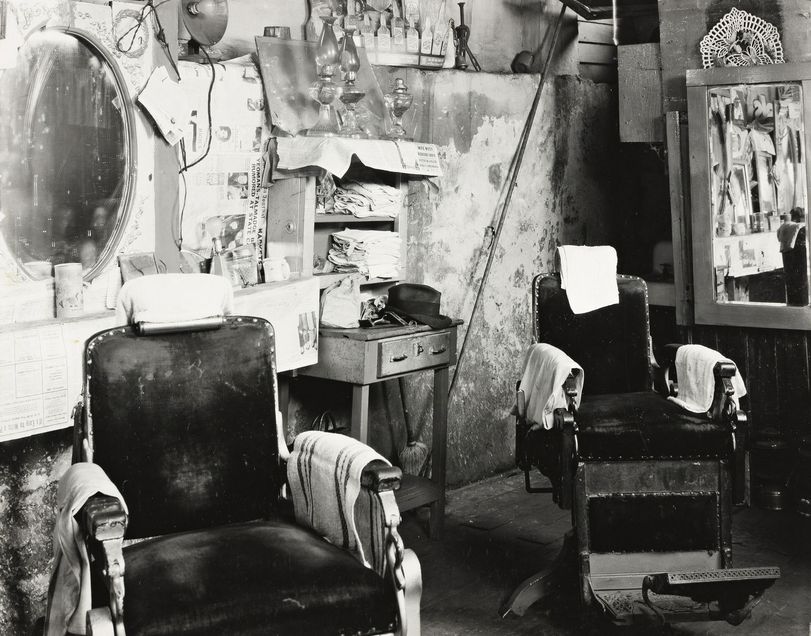 WALKER EVANS (1903-1975) Negroes' Barbershop Interior, Atlanta, Georgia.: WALKER EVANS (1903-1975)Negroes' Barbershop Interior, Atlanta, Georgia. Silver print, the image measuring 191x241 mm; 7½x9½ inches, the sheet slightly larger, with Evans' credit and nega