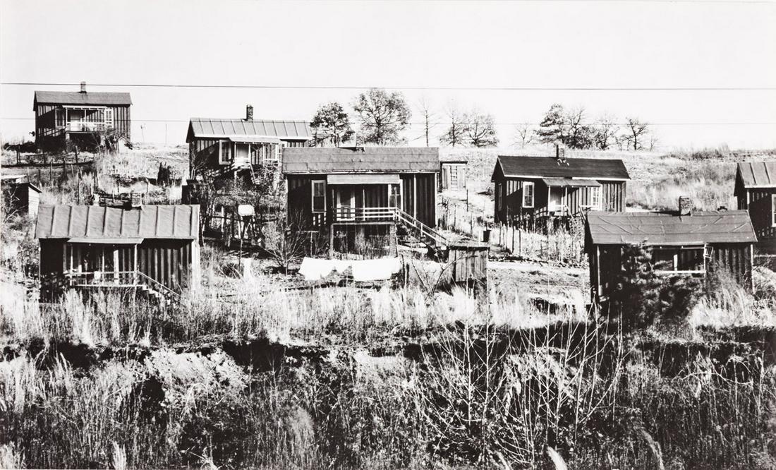 WALKER EVANS (1903-1975) Miners' Houses, Birmingham, Alabama.: WALKER EVANS (1903-1975)Miners' Houses, Birmingham, Alabama. Silver print, the image measuring 152x250 mm; 6x9 inches, flush mounted, with Evans' credit in pencil on mount verso; and an "The American