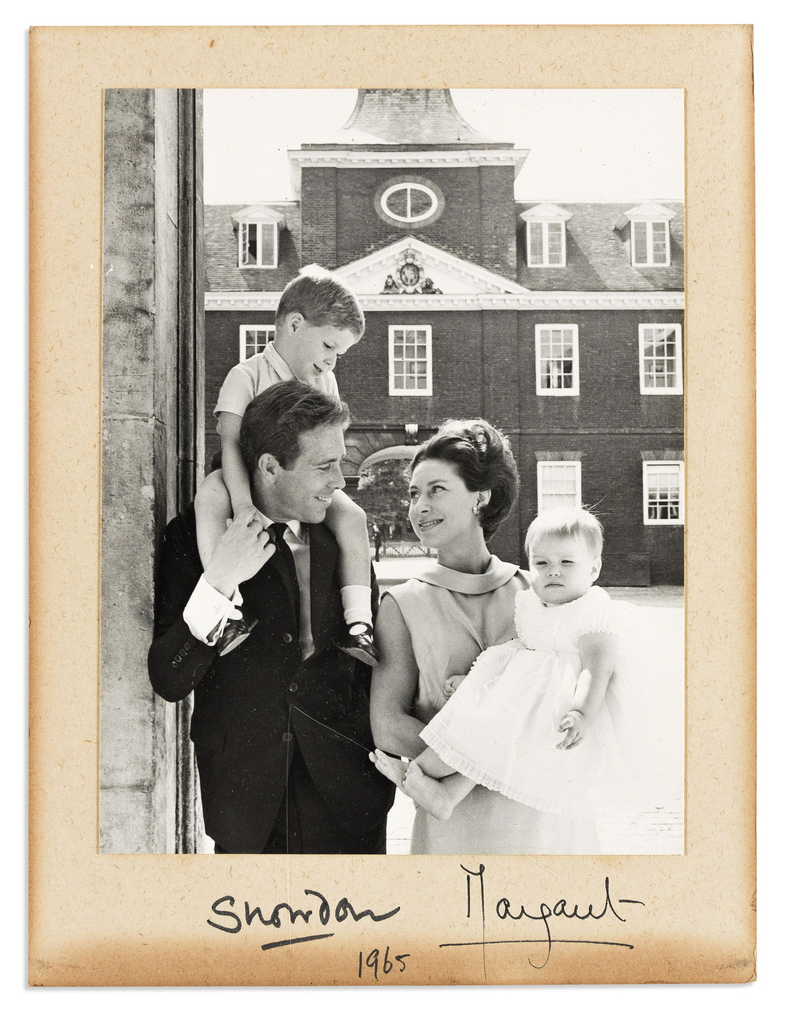 (ROYALTY.) PRINCESS MARGARET; AND ANTONY ARMSTRONG-JONES. Photograph Signed, by both ("Margaret" and: (ROYALTY.) PRINCESS MARGARET; AND ANTONY ARMSTRONG-JONES. Photograph Signed, by both ("Margaret" and "Snowdon"), half-length portrait by Cecil Beaton showing them carrying their children, Sarah and Da